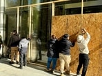 Businesses are boarded up in downtown Washington, DC, on November 3, 2024, as security measures are taken for possible violence after the November 5 election. (Photo by Daniel SLIM / AFP) Businesses are boarded up in downtown Washington, DC, on November 3, 2024, as security measures are taken for possible violence after the November 5 election. (Photo by Daniel SLIM / AFP)