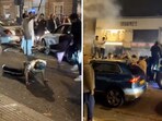 In the video, men climb cars, jump and dance as one of them starts doing push-ups on the road. In the video, men climb cars, jump and dance as one of them starts doing push-ups on the road.