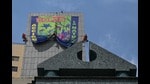 Greenpeace activists hang on a building a banner that reads “COP 16 Action for Nature” in Cali, Valle del Cauca department, Colombia, on October 18, 2024. The 2024 United Nations Biodiversity Conference of the Parties to the UN Convention on Biological Diversity (COP16) will be held in Cali, Colombia, from October 21 to November 1, 2024. (Photo by JOAQUIN SARMIENTO / AFP) (AFP)
