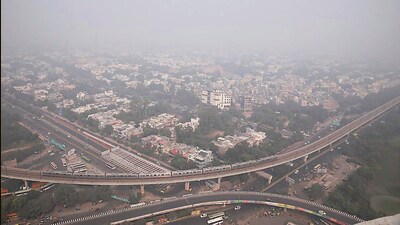 A blanket of smog covers Noida on Monday. (PTI) A blanket of smog covers Noida on Monday. (PTI)