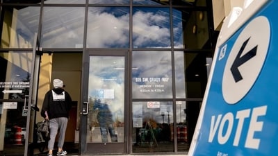 A voter arrives to cast their ballot at the King County Elections headquarters in Renton, Washington, US, on Monday. (Bloomberg) A voter arrives to cast their ballot at the King County Elections headquarters in Renton, Washington, US, on Monday. (Bloomberg)