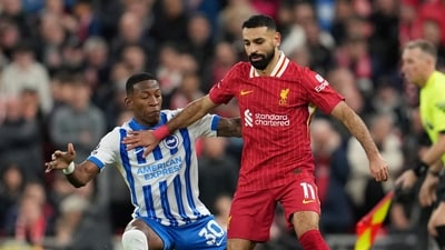 Liverpool's Mohamed Salah, right, challenges for the ball with Brighton's Pervis Estupinan. (AP Photo/Jon Super) (AP) Liverpool's Mohamed Salah, right, challenges for the ball with Brighton's Pervis Estupinan. (AP Photo/Jon Super) (AP)