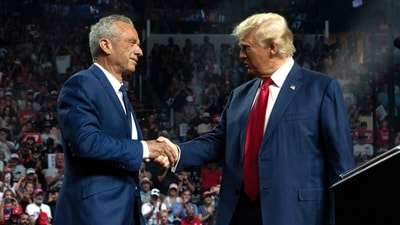 Former Republican presidential candidate Robert F. Kennedy Jr. and former US President and Republican presidential candidate Donald Trump shake hands during a campaign rally at Desert Diamond Arena on August 23, 2024 in Glendale, Arizona. (AFP) Former Republican presidential candidate Robert F. Kennedy Jr. and former US President and Republican presidential candidate Donald Trump shake hands during a campaign rally at Desert Diamond Arena on August 23, 2024 in Glendale, Arizona. (AFP)