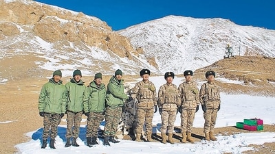 Indian and Chinese army greet each other along the Line of Actual Control (LAC) near Karakoram pass in Ladakh on Thursday. (AFP) Indian and Chinese army greet each other along the Line of Actual Control (LAC) near Karakoram pass in Ladakh on Thursday. (AFP)
