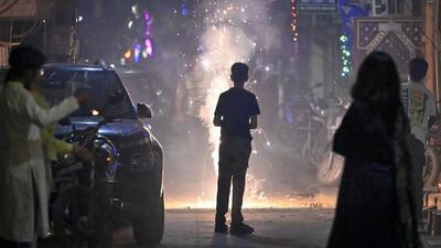 People burning firecrackers on the occasion of Diwali at Pandav Nagar in east Delhi, on Thursday. (RAJ K RAJ /HT PHOTO)