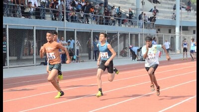Players in action during 100-metre race at the state-level Khedan Watan Punjab Diyan at Guru Nanak Stadium in Ludhiana on Monday. (Gurpreet Singh/Hindustan Times)