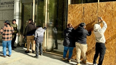 Businesses are boarded up in downtown Washington, DC, on November 3, 2024, as security measures are taken for possible violence after the November 5 election. (Photo by Daniel SLIM / AFP) (AFP) Businesses are boarded up in downtown Washington, DC, on November 3, 2024, as security measures are taken for possible violence after the November 5 election. (Photo by Daniel SLIM / AFP) (AFP)