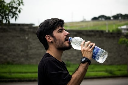 It's easy to forget to drink enough water on vacation. This can lead to constipation, dehydration, fatigue, dizziness, headaches. Keep a reusable water bottle on hand, set reminders to drink, and add in extra electrolytes for better hydration. (pexels)