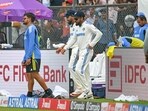 India's Virat Kohli (C) and captain Rohit Sharma arrive for the second innings on the second day of the third Test cricket match between India and New Zealand at the Wankhede stadium in Mumbai on November 2 India's Virat Kohli (C) and captain Rohit Sharma arrive for the second innings on the second day of the third Test cricket match between India and New Zealand at the Wankhede stadium in Mumbai on November 2