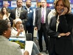 Democratic presidential nominee Vice President Kamala Harris, right, phone banks with volunteers at the DNC headquarters on Election Day, Tuesday, Nov. 5, 2024, in Washington. (AP Photo/Jacquelyn Martin) Democratic presidential nominee Vice President Kamala Harris, right, phone banks with volunteers at the DNC headquarters on Election Day, Tuesday, Nov. 5, 2024, in Washington. (AP Photo/Jacquelyn Martin)