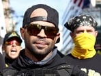 Members of the far-right Proud Boys, including leader Enrique Tarrio (C), rally in support of U.S. President Donald Trump to protest against the results of the 2020 U.S. presidential election, in Washington, U.S. November 14, 2020. 