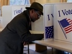 A man votes during the 2024 U.S. presidential election on Election Day, at a library in Pittsburgh, Pennsylvania, U.S., November 5, 2024. REUTERS/Jeenah Moon