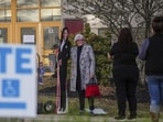 A voter poses for a cardboard cutout of Democratic presidential nominee Vice President Kamala Harris before voting opens at Scranton High School in Scranton, Pa., on Election Day, Tuesday (AP) A voter poses for a cardboard cutout of Democratic presidential nominee Vice President Kamala Harris before voting opens at Scranton High School in Scranton, Pa., on Election Day, Tuesday (AP)