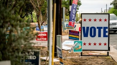 Campaign signs outside a polling location for the 2024 Presidential election in Austin, Texas, US, on Tuesday, Nov. 5, 2024. The 2024 presidential campaign was marked by two assassination attempts, a candidate switch, divisive rhetoric and warnings about the fate of democracy. Photographer: Sergio Flores/Bloomberg (Bloomberg) Campaign signs outside a polling location for the 2024 Presidential election in Austin, Texas, US, on Tuesday, Nov. 5, 2024. The 2024 presidential campaign was marked by two assassination attempts, a candidate switch, divisive rhetoric and warnings about the fate of democracy. Photographer: Sergio Flores/Bloomberg (Bloomberg)