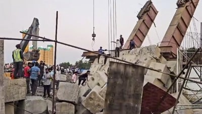 A structure at the construction site near Vasad gave way, causing a portion of the bridge to crash down. (PTI)