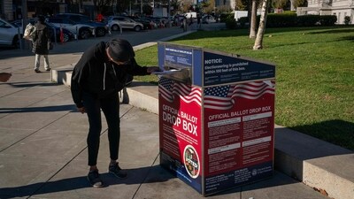 A voter drops off ballots at an official ballot drop box on the final day of early voting ahead of Election Day at City Hall on November 4, 2024 in San Francisco, California. (Getty Images via AFP) A voter drops off ballots at an official ballot drop box on the final day of early voting ahead of Election Day at City Hall on November 4, 2024 in San Francisco, California. (Getty Images via AFP)