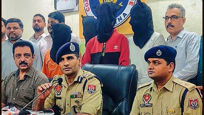 Commissioner of Police Ludhiana Kuldeep Singh Chahal with other senior police officials addressing the media persons regarding the arrest of accused in petrol bomb attack in Ludhiana on Tuesday. (Hindustan Times) Commissioner of Police Ludhiana Kuldeep Singh Chahal with other senior police officials addressing the media persons regarding the arrest of accused in petrol bomb attack in Ludhiana on Tuesday. (Hindustan Times)