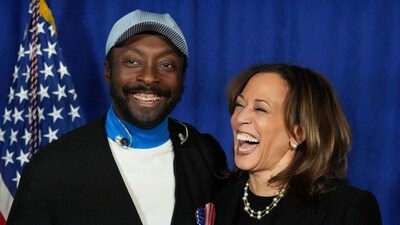 Democratic presidential nominee Vice President Kamala Harris, right, laughs as she poses with will.i.am at a campaign rally outside the Philadelphia Museum of Art, Monday, Nov. 4, 2024, in Philadelphia. (AP Photo/Jacquelyn Martin) (AP)