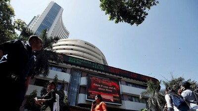 People walk past the Bombay Stock Exchange (BSE) building in Mumbai, India, March 9, 2020 (Francis Mascarenhas/Reuters)