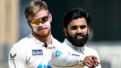 New Zealand's Ajaz Patel (R) gestures as Glenn Phillips watches during the Mumbai Test on Sunday. (AFP) (AFP ) New Zealand's Ajaz Patel (R) gestures as Glenn Phillips watches during the Mumbai Test on Sunday. (AFP) (AFP )