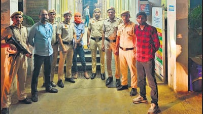 Police officers with the arrested accused who was nabbed from near his Paschim Vihar house on Monday. (HT Photo) Police officers with the arrested accused who was nabbed from near his Paschim Vihar house on Monday. (HT Photo)