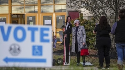 A voter poses for a cardboard cutout of Democratic presidential nominee Vice President Kamala Harris before voting opens at Scranton High School in Scranton, Pa., on Election Day, Tuesday (AP) A voter poses for a cardboard cutout of Democratic presidential nominee Vice President Kamala Harris before voting opens at Scranton High School in Scranton, Pa., on Election Day, Tuesday (AP)