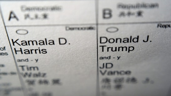 Candidates for president and vice president of the United States, Democrats Vice President Kamala Harris and Minnesota Gov. Tim Walz, and Republicans former President Donald Trump and Sen. JD Vance, R-Ohio, are seen on part of a mail-in election ballot in New York on Sunday, Nov. 3, 2024. (AP Photo/Patrick Sison) (AP)