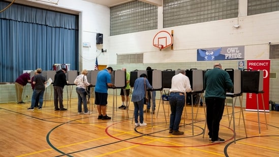 Voters mark their ballots at a polling location for the 2024 Presidential election in Dearborn, Michigan, US, on Tuesday, Nov. 5, 2024. (Bloomberg)
