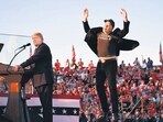 Elon Musk jumps on stage as he joins former US President and Republican presidential nominee Donald Trump during a rally in Butler, Pennsylvania in October. (AFP)