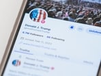 The Truth Social account for former President Donald Trump is seen on a mobile device.