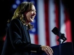 Democratic presidential nominee Kamala Harris laughs during a campaign rally in Philadelphia.