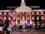 An attendee waves a U.S. flag at Democratic presidential nominee U.S. Vice President Kamala Harris's election night rally during the 2024 U.S. presidential election, at Howard University, in Washington, U.S., November 5, 2024 REUTERS/Hannah McKay