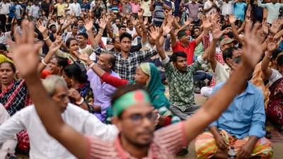 Bangladesh Hindus shout slogans during a protest rally to demand that an interim government withdraw all cases against their leaders and protect them from attacks and harassment in Dhaka. (AP)