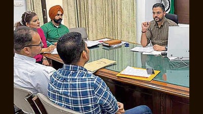 Deputy commissioner Jitendra Jorwal in a meeting with officials over procurement of paddy in Ludhiana on Wednesday. (Manish/HT)