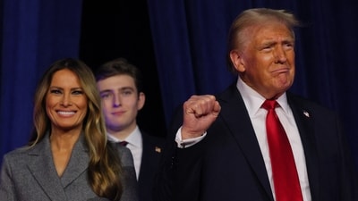 Republican presidential nominee Donald Trump makes a fist as he takes the stage at his rally, at the Palm Beach County Convention Center. (REUTERS)