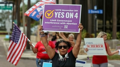 Beth Weinstein rallies in supporter of Yes on Amendment 4 regarding abortion in Florida outside of the polling place at the courthouse (AP) Beth Weinstein rallies in supporter of Yes on Amendment 4 regarding abortion in Florida outside of the polling place at the courthouse (AP)