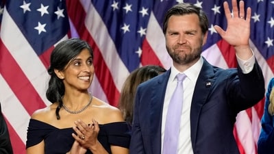 Republican vice presidential nominee Sen. JD Vance, R-Ohio, waves as his wife Usha Vance looks on at an election night watch party, Wednesday, Nov. 6, 2024, in West Palm Beach, Fla. (AP) Republican vice presidential nominee Sen. JD Vance, R-Ohio, waves as his wife Usha Vance looks on at an election night watch party, Wednesday, Nov. 6, 2024, in West Palm Beach, Fla. (AP)
