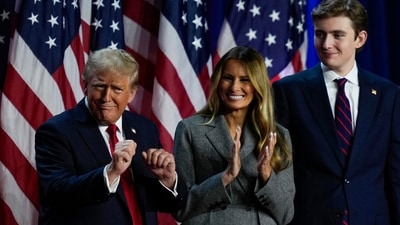 Donald Trump dances on stage with former first lady Melania Trump, and son Barron Trump at the election night watch party, Wednesday. (AP Photo/Julia Demaree Nikhinson) (AP) Donald Trump dances on stage with former first lady Melania Trump, and son Barron Trump at the election night watch party, Wednesday. (AP Photo/Julia Demaree Nikhinson) (AP)
