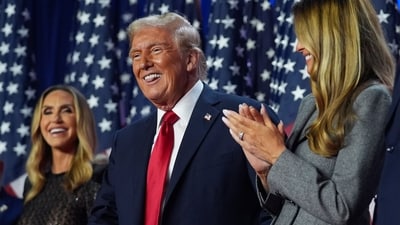 Republican presidential nominee former President Donald Trump stands on stage with former first lady Melania Trump. (AP Photo/Evan Vucci) (AP) Republican presidential nominee former President Donald Trump stands on stage with former first lady Melania Trump. (AP Photo/Evan Vucci) (AP)