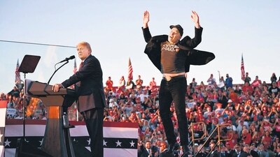 Elon Musk jumps on stage as he joins former US President and Republican presidential nominee Donald Trump during a rally in Butler, Pennsylvania in October. (AFP) Elon Musk jumps on stage as he joins former US President and Republican presidential nominee Donald Trump during a rally in Butler, Pennsylvania in October. (AFP)