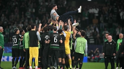 Sporting Lisbon's Portuguese coach Ruben Amorim is celebrated by his players at the end of the UEFA Champions League, league phase day 4 football match between Sporting Lisbon and Manchester City (AFP)