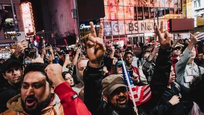 Onlookers watch as results of the 2024 US Presidential election are broadcast in Times Square in New York, US, on Wednesday. (Bloomberg) Onlookers watch as results of the 2024 US Presidential election are broadcast in Times Square in New York, US, on Wednesday. (Bloomberg)