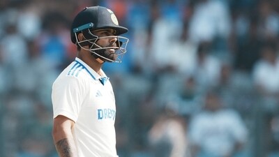 Mumbai: India's Virat Kohli walks off the field after losing his wicket during day three of third Test cricket match between India and New Zealand (PTI) Mumbai: India's Virat Kohli walks off the field after losing his wicket during day three of third Test cricket match between India and New Zealand (PTI)
