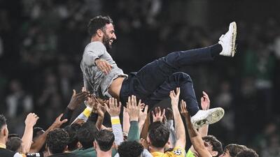 Sporting Lisbon's Portuguese coach Ruben Amorim is celebrated by his players after beating Man City on Tuesday. (AFP)