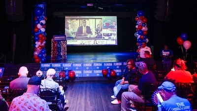 People attend a Democratic watch party as they wait for US election results in Orlando, Florida. (AFP) People attend a Democratic watch party as they wait for US election results in Orlando, Florida. (AFP)