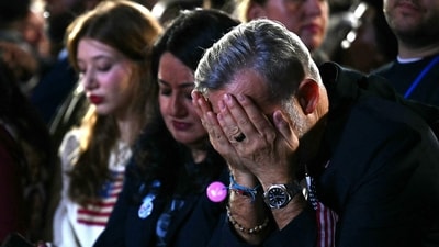 A supporter reacts to election results during an election night event for US Vice President and Democratic presidential candidate Kamala Harris at Howard University in Washington, DC. (AFP) A supporter reacts to election results during an election night event for US Vice President and Democratic presidential candidate Kamala Harris at Howard University in Washington, DC. (AFP)