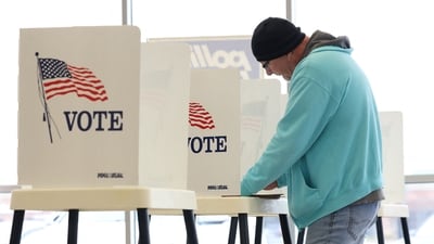 A person votes during the 2024 U.S. Presidential Election on Election Day in the showroom of Superior Honda of Omaha in Omaha, Nebraska, U.S. (REUTERS)