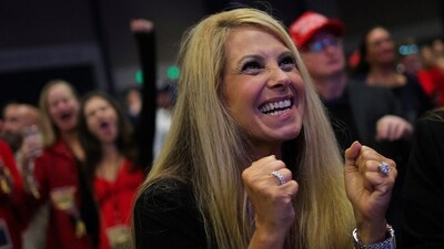 A supporter of Republican presidential nominee and former US President Donald Trump reacts while watching early results at the site of the Election Night rally in West Palm Beach, Florida. (REUTERS)