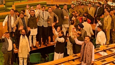 Bharatiya Janata Party (BJP) members shout slogans against the resolution passed by Jammu and Kashmir assembly seeking the restoration of special status. (AFP)