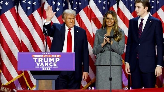 Former US President Donald Trump, from left, former US First Lady Melania Trump, and their son Barron Trump during an election night event at the Palm Beach Convention Center in West Palm Beach, Florida, US, on Wednesday, Nov. 6, 2024.. Photographer: Eva Marie Uzcategui/Bloomberg (Bloomberg)